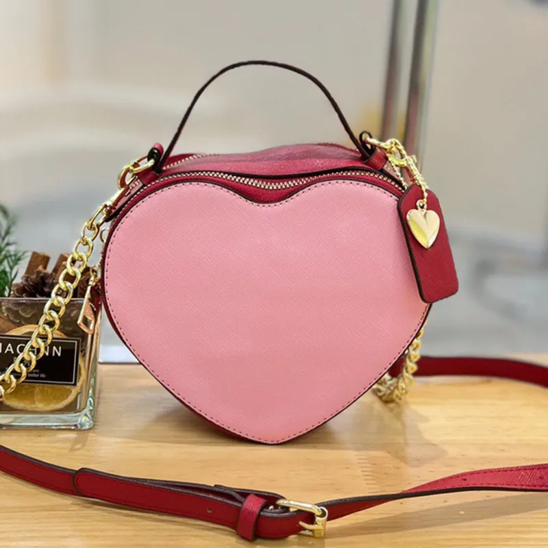 Sac à bandoulière pour femme style luxe design de marque célèbre en cuir PU avec cœur, sac à main populaire avec lettre ouverte pour la Saint-Valenti